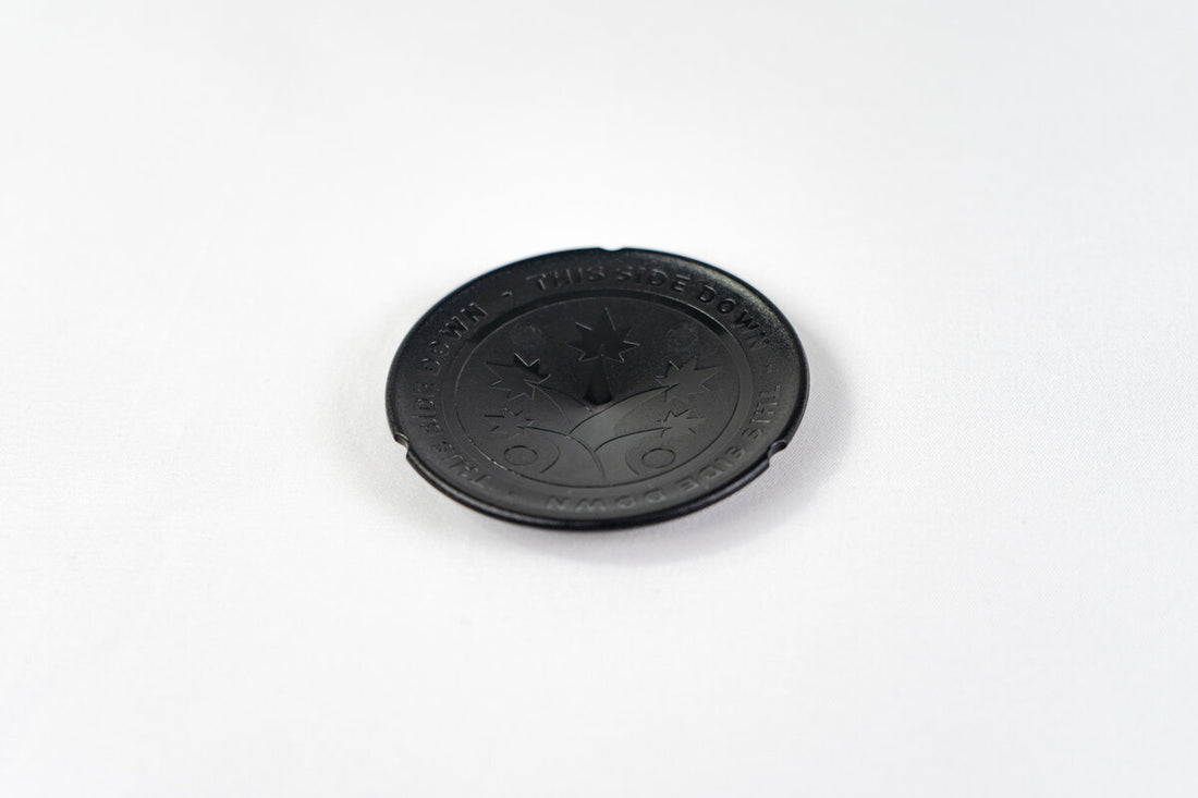 Black BudCups bottom insert with BudTrainer logo and drainage spike for healthy cannabis root growth.