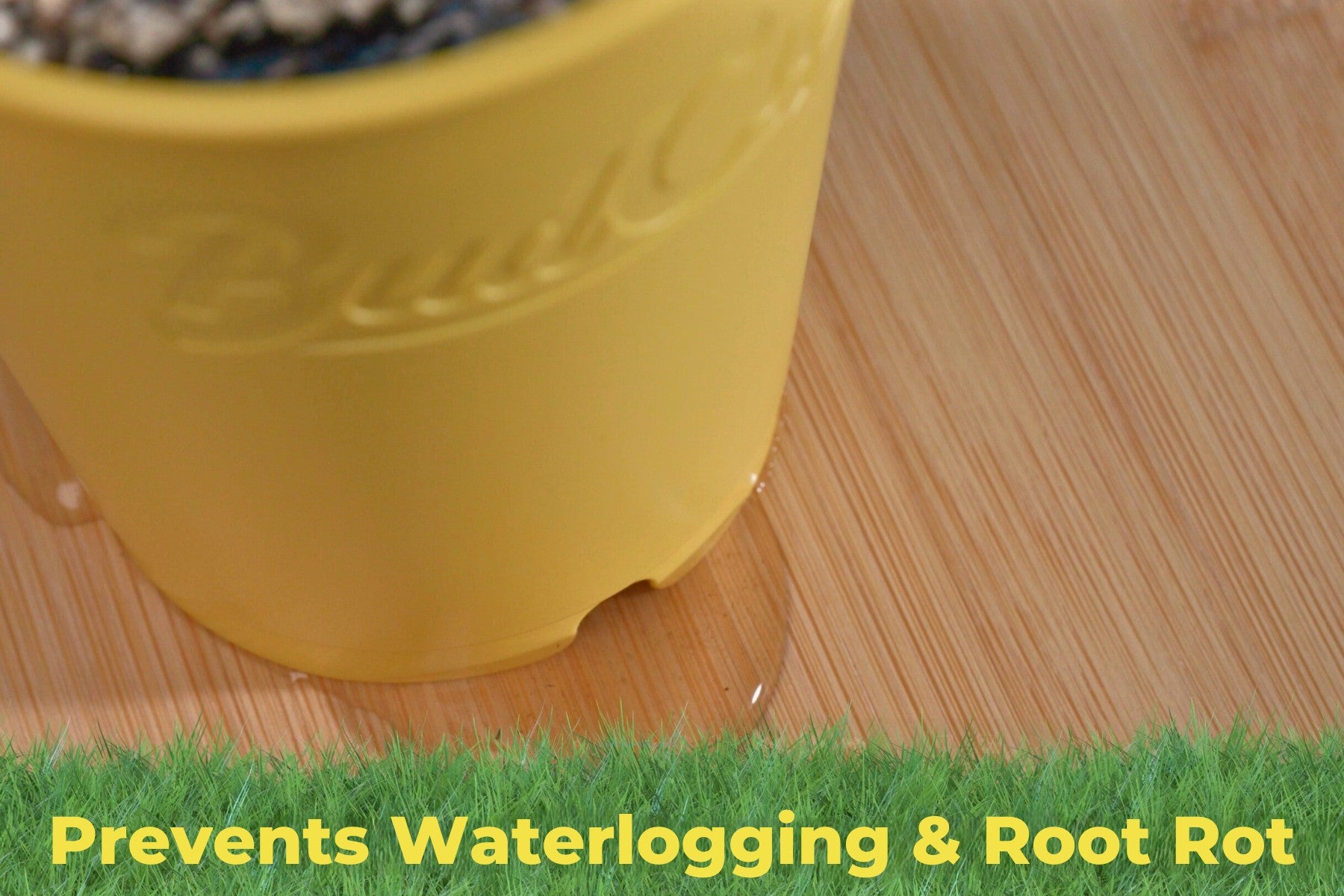 Yellow BudCups pot showing water drainage on bamboo surface to prevent waterlogging and root rot.