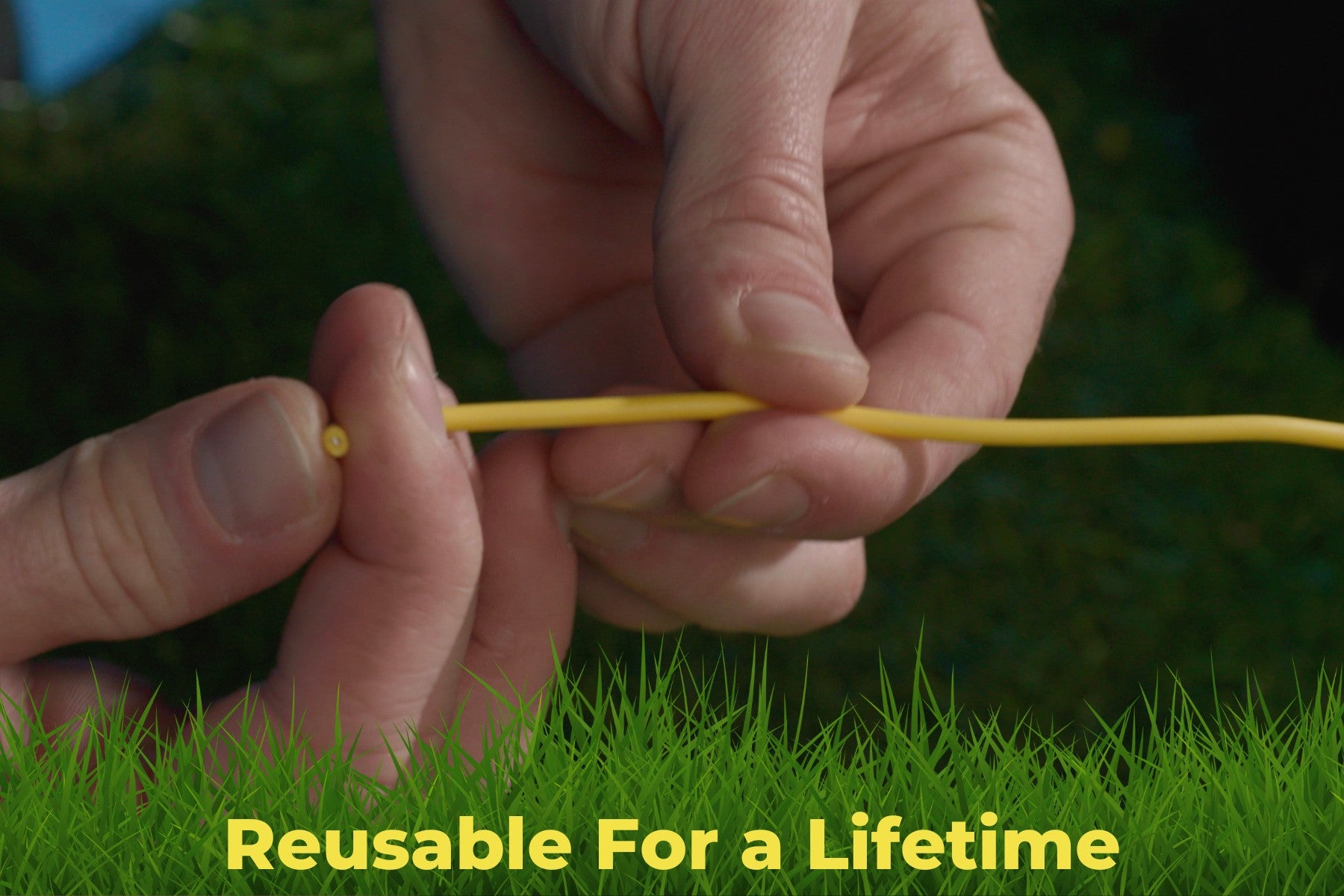 Hands holding flexible yellow BudHuggers training wire, emphasizing durability and reusability for a lifetime.