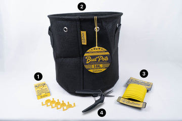 Cannabis plant training kit including BudClips, a 5-gallon BudPot fabric grow container, BudHuggers plant ties, and fine-tip pruning scissors.