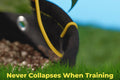 Close-up of BudPot fabric planter staying firm during plant training with tie-down wire.