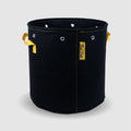 BudTrainer BudPots black fabric grow pot with yellow handles and steel-reinforced rim for home cannabis cultivation.